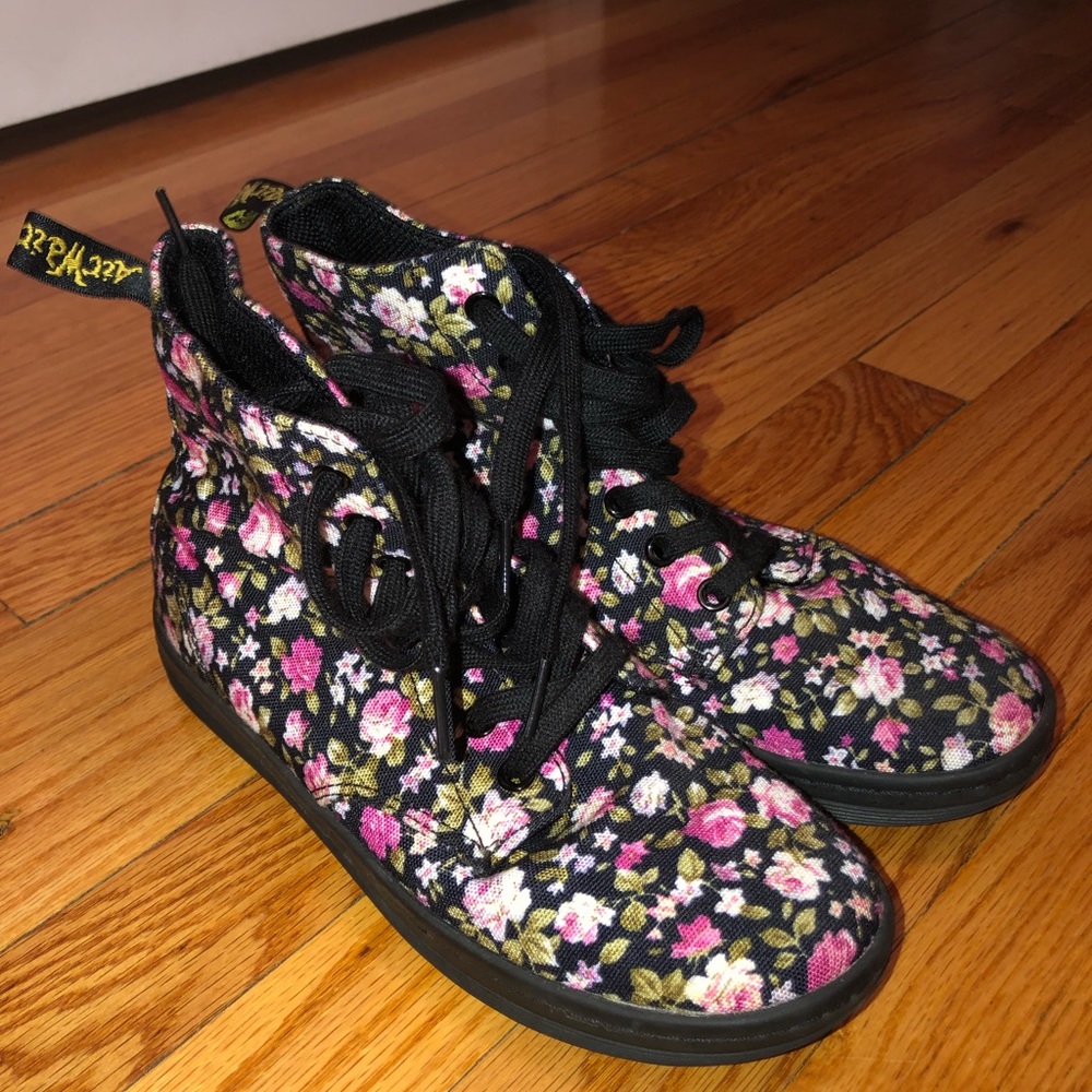 Dr. Martens black shoes with flowers on it